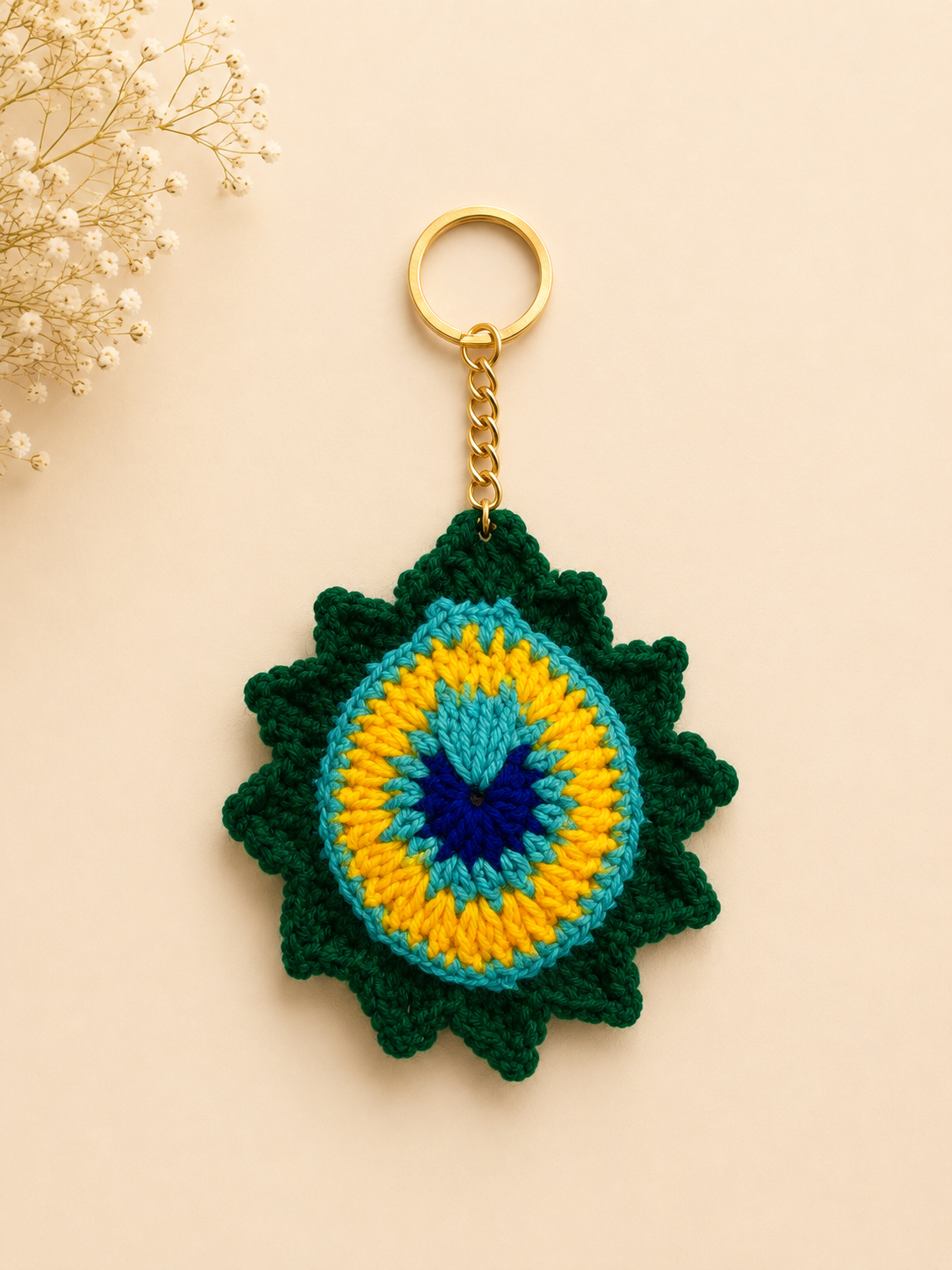 Royal Plume Handcrafted Crochet Peacock Feather Keychain – lifestyle shot on beige handbag