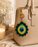 Royal Plume Handcrafted Crochet Peacock Feather Keychain – flat lay showing peacock feather medallion detail