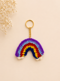 Rainbow Delight Handcrafted Crochet Keychain – flat lay showing vibrant rainbow arch with white cloud base