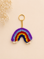 Rainbow Delight Handcrafted Crochet Keychain – flat lay showing vibrant rainbow arch with white cloud base