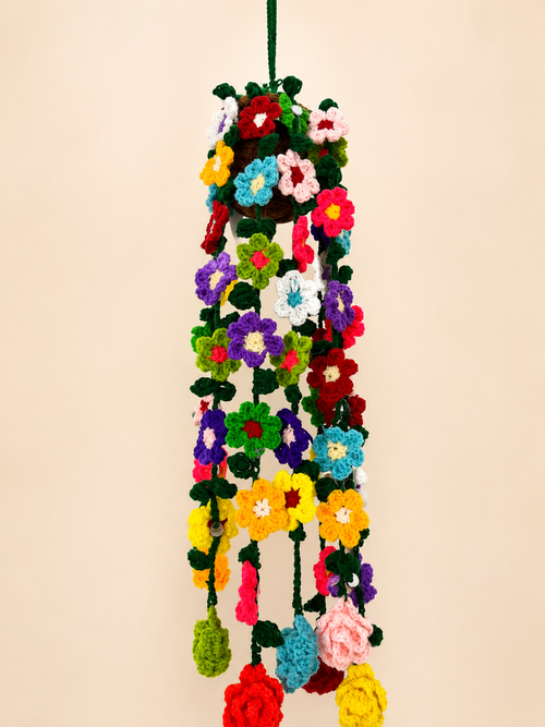 Blossom Cascade Handcrafted Crochet Hanging Flower Pot – close-up of rainbow crochet flowers cascading from dark green pot