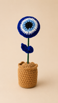 Guardian Blessing Handcrafted Evil Eye Crochet Keepsake with blue white and black concentric bloom in a caramel crochet pot