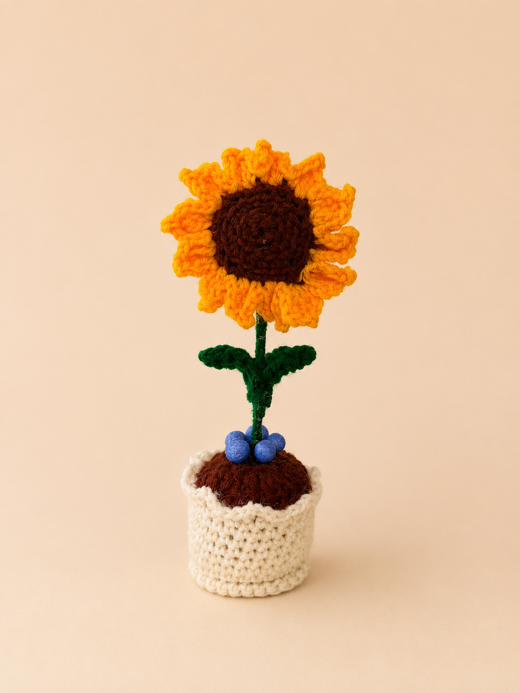 Sunny Promise Handcrafted Crochet Sunflower Keepsake with golden orange petals and dark brown centre in a cream crochet pot