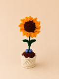 Sunny Promise Handcrafted Crochet Sunflower Keepsake with golden orange petals and dark brown centre in a cream crochet pot