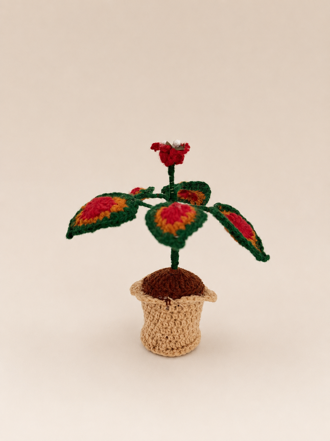 Crimson Harmony handcrafted crochet foliage keepsake in a crocheted pot
