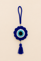 Guardian Gaze handcrafted crochet evil eye hanging in royal blue with silver beads and tassel