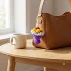 Mini Crochet Bouquet Bag Charm on a tan leather handbag