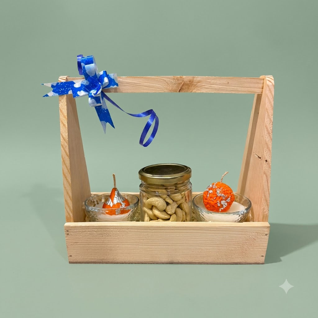 Diwali Gift Hamper with Fragrance showing two scented mithai candle bowls, a dry-fruit jar, wooden holder, and greeting card
