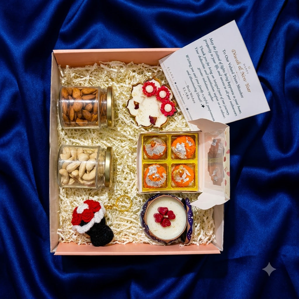 Diwali Gift Hamper Deluxe showing eco-friendly scented candles, rose jar candle, dry-fruit jars, bouquet bag charm, and greeting card