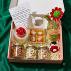 Premium Diwali Gift Hamper with Rose Candle and Keepsake showing three dry-fruit jars, four scented mithai candles, rose candle, and two bag charms