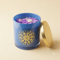 Lavender Bloom floral soy wax candle in blue glass jar with gold lid – clean product shot