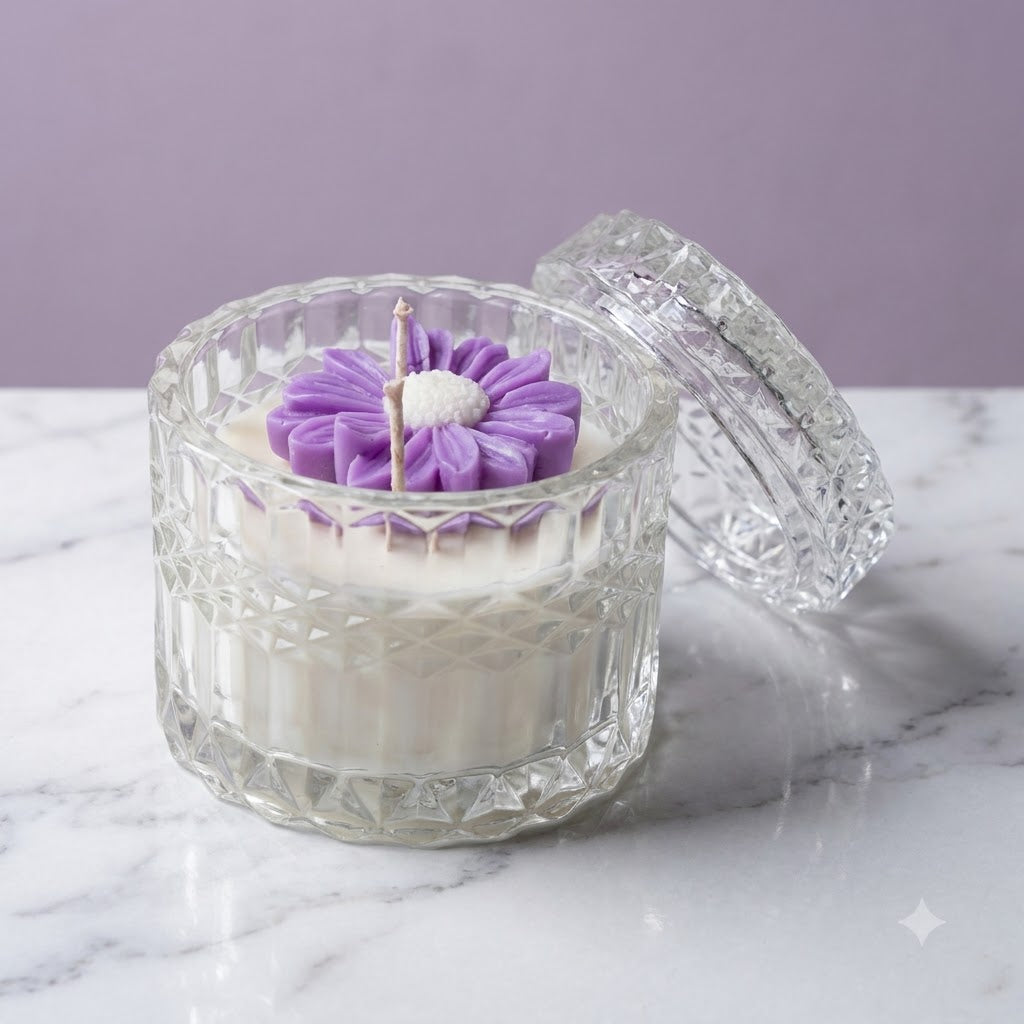 Premium scented purple daisy soy candle in a clear glass jar with lid