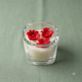 Premium scented red flower trio soy candle in a clear glass jar